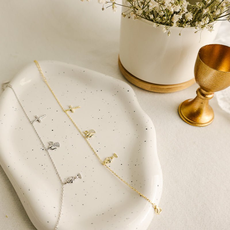 Pulseira em Prata e Zircónias adornada com Anjo, Cruz e Cálice - Loja do Ouro