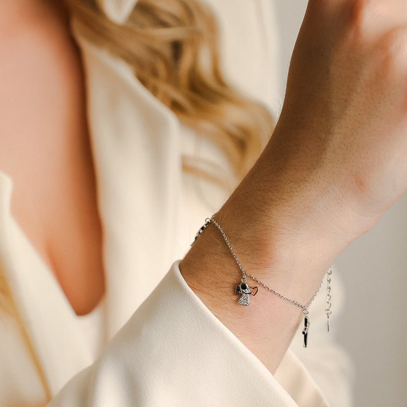 Pulseira em Prata e Zircónias adornada com Anjo, Cruz e Cálice - Loja do Ouro